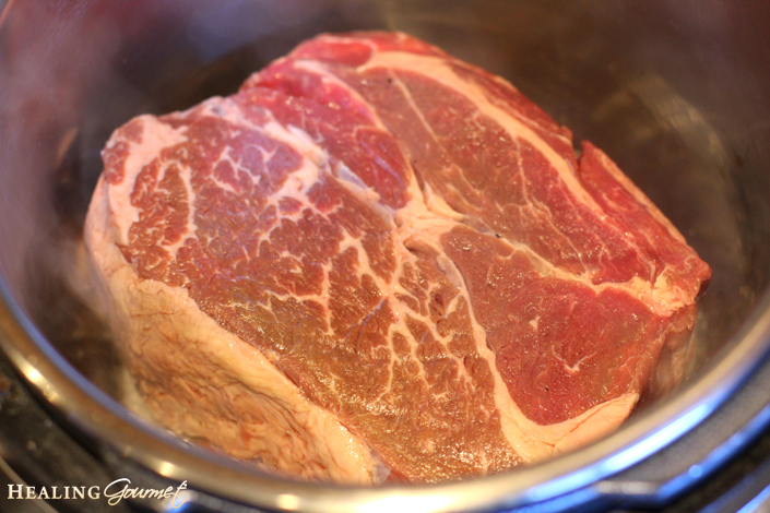 Image of Pressure Cooker Pot Roast in heated oil in the Instant Pot